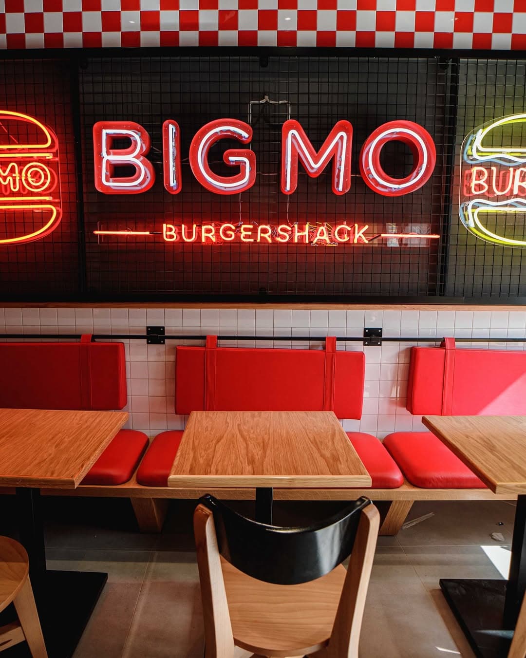 Neon lighting reflecting across the BIG MO interior